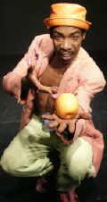 Donald Carr presenting a goldern apple. 